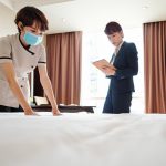 Maid making bed